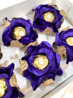  royal blue flowers with gold mesh arranged in a box