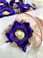 Ferrero Rocher chocolate in a  royal blue rose-shaped container with gold accents.